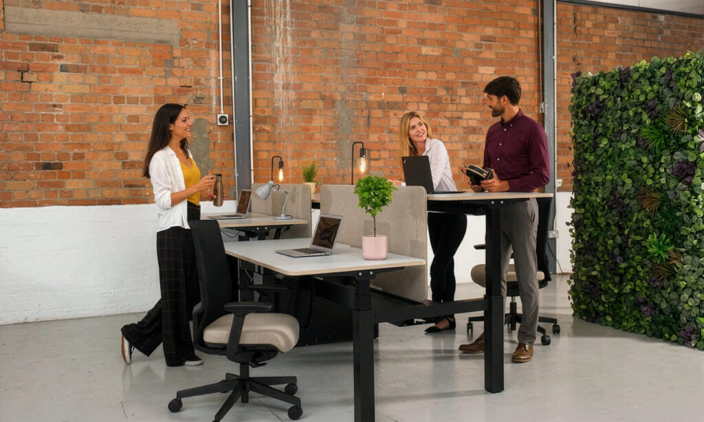 Modern Height Adjustable Desk With Smooth Lift Mechanism Allowing Users To Switch Between Sitting And Standing For Improved Focus And Productivity.